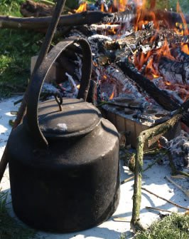 Picture of tea making outside next to fire