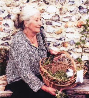 Woman holding basket sat outside