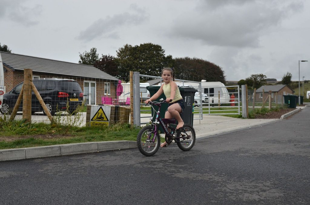 Picture of girl riding bike on a site