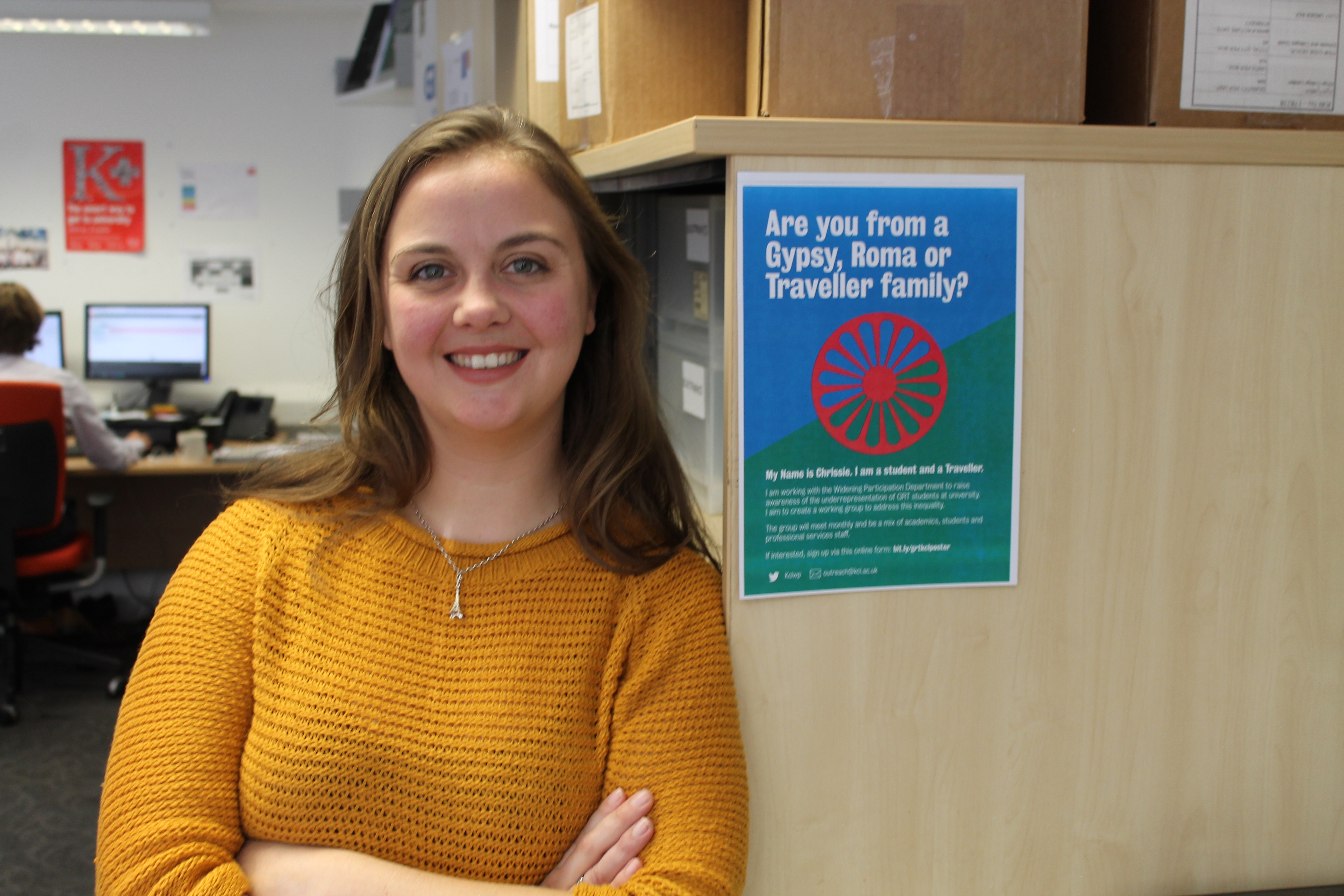 Picture of Chrissie Borne next to a Gypsy Roma Traveller poster