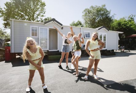 Picture of kids posing and laughing on a site